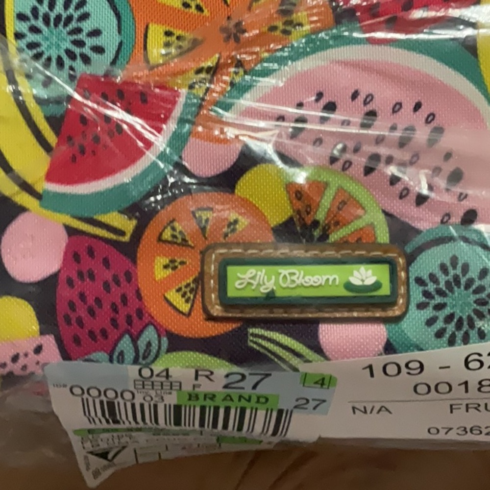 Lily bloom cross body or shoulder bag new with tag.3 zipper compartments.